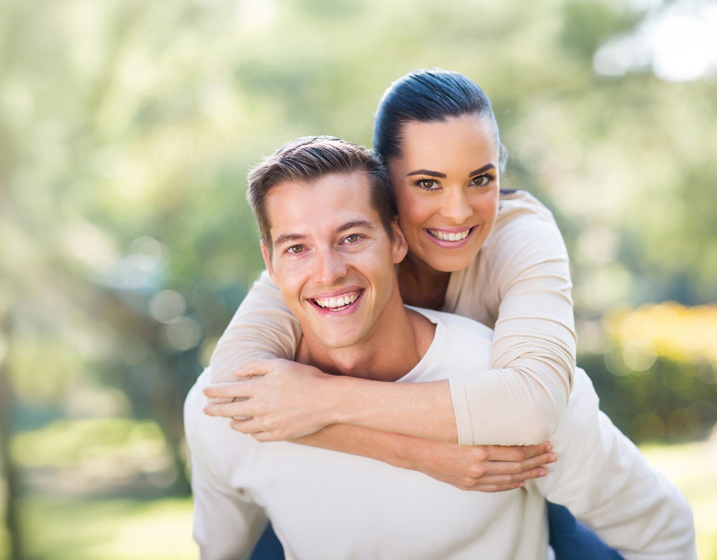 Smiling couple from the Purple Dental Care patient plan flyer